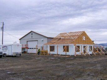 ceiling trusses being raised on shed company roof