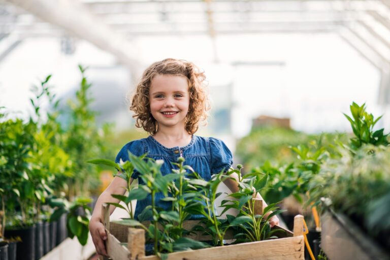 girl in small greenhouse