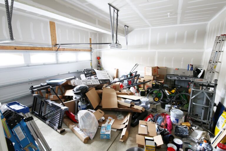 Unorganized messy garage before he purchased a shed in Island City and La Grande