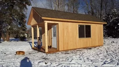 winter and log cabin shed